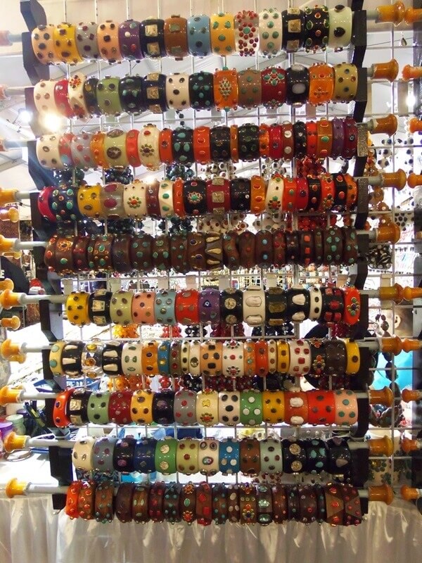 Don't  you love this colorful display of Bakelite bangles vivid colors and hand crafts that include handbags and apparel.