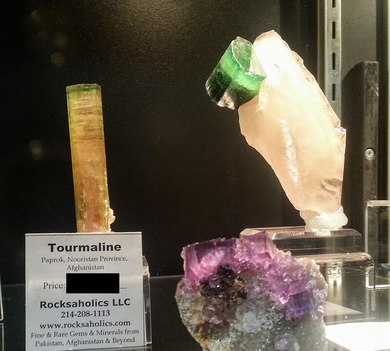 Fabulous Tourmaline perched on the edge of a slice of Quartz from "Rocksaholics" at the Denver Gem & Mineral Show in 2019. Sadly, DGMS closed in 2021 and its dealers are all at other shows.