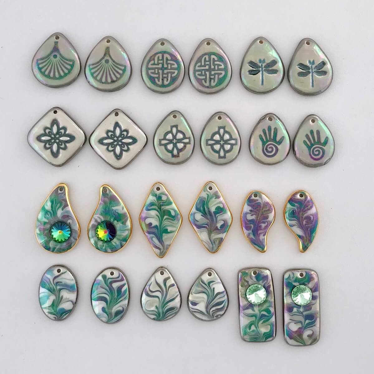 Earring components in shades of green.