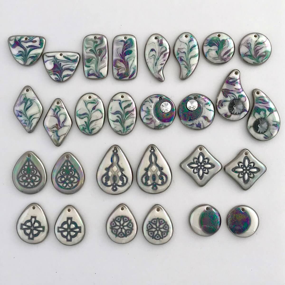 Earring components in our very popular black & white colorway, the iridescent overglaze reflects the colors you were these with, so they match all of your outfits.