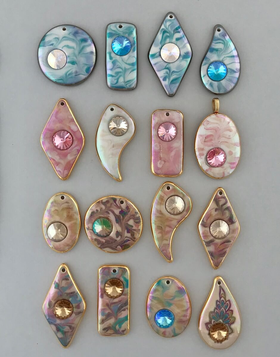 Marbled pendants accented with Swarovski Rivoli crystals.