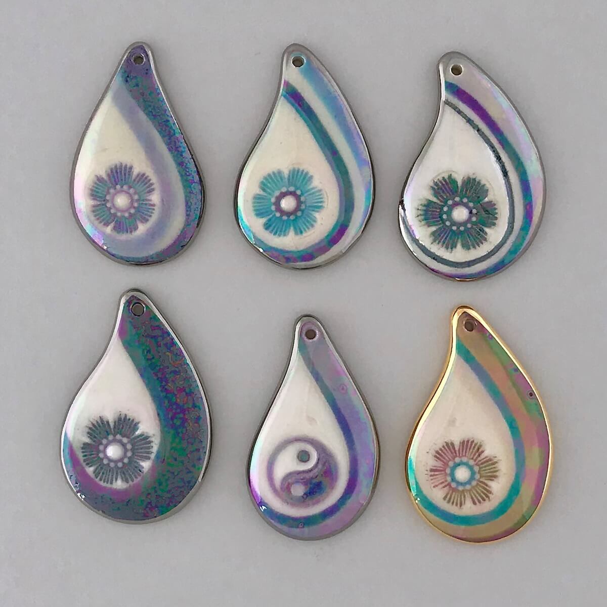 Handpainted teardrop pendants with pictorial accents.