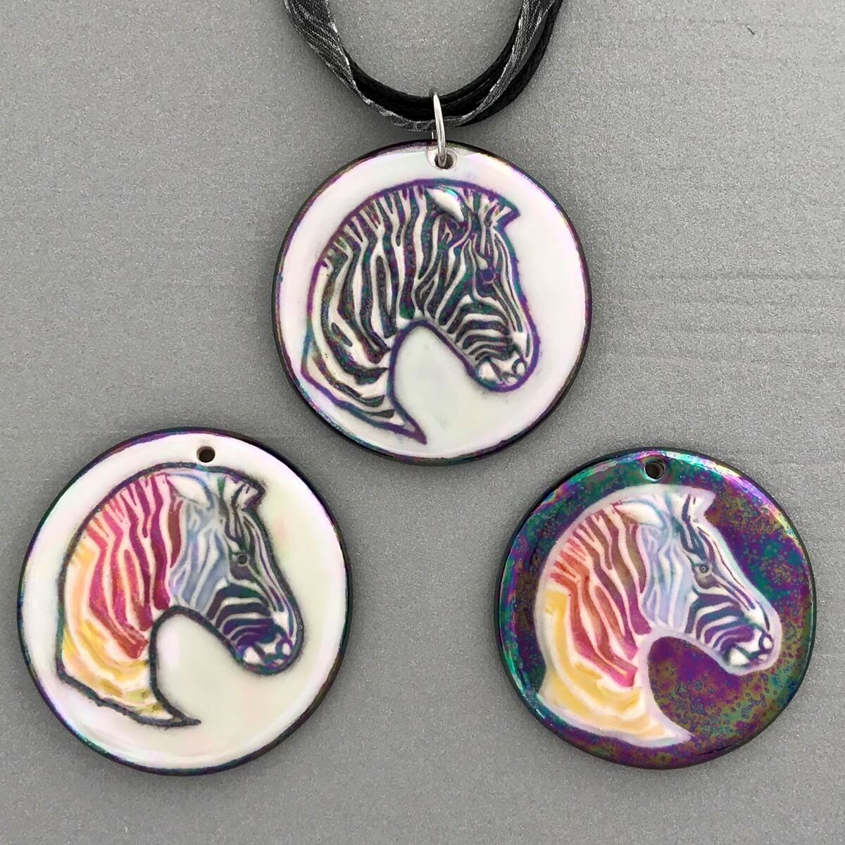 New zebra pictorial pendants, traditional coloring and rainbow with opalescent or black rainbow backgrounds.