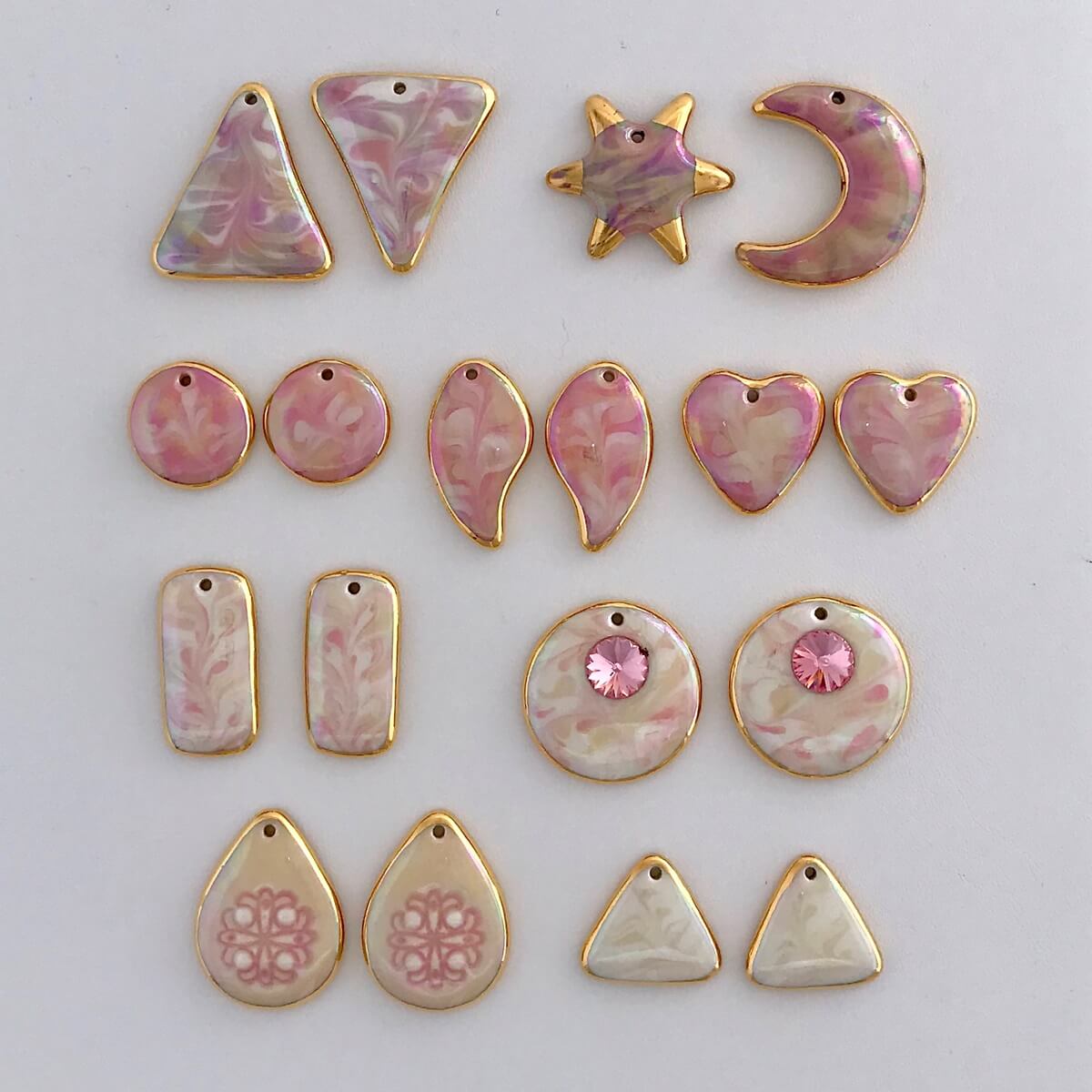 Earring components in shades of pink.