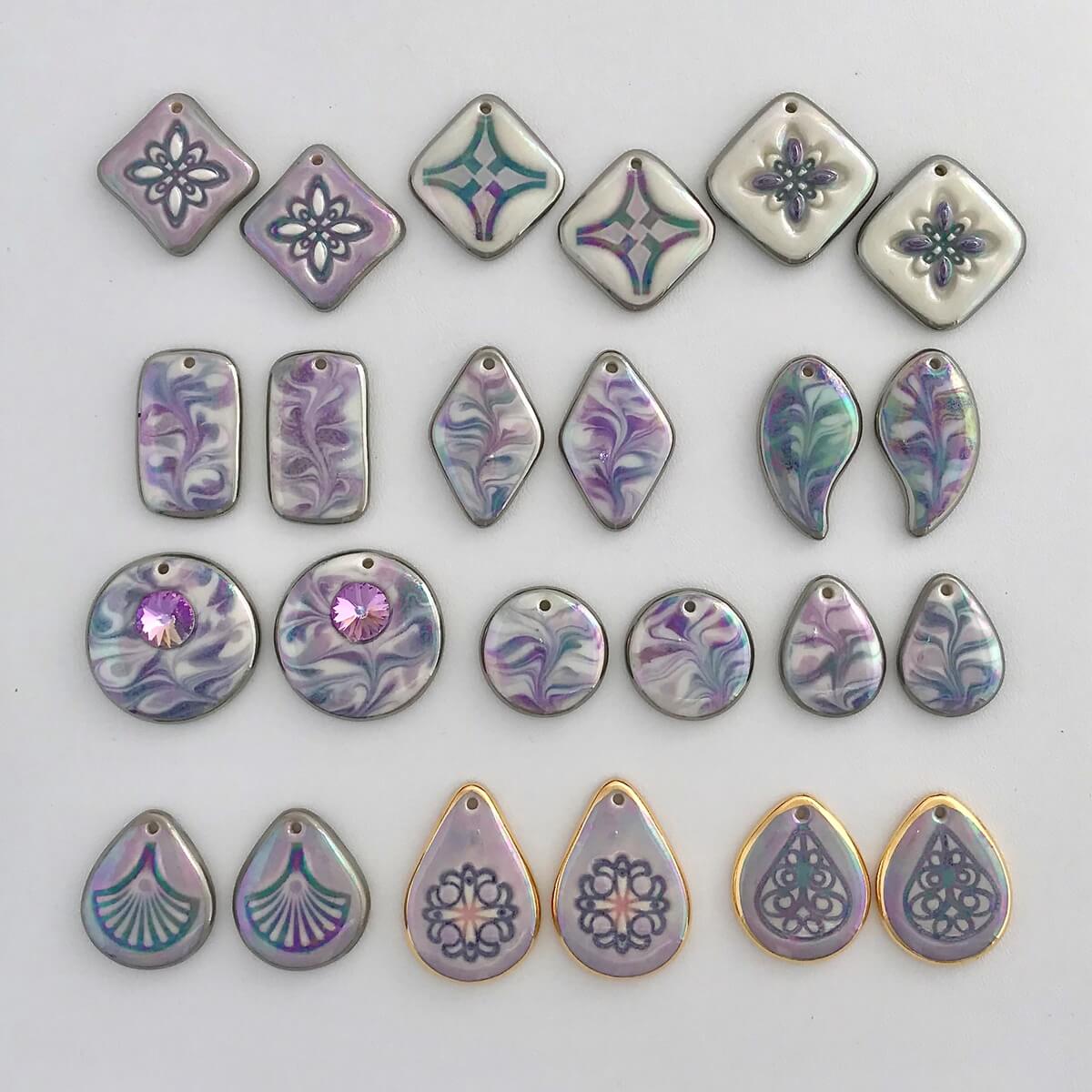 Earring components in shades of purple.