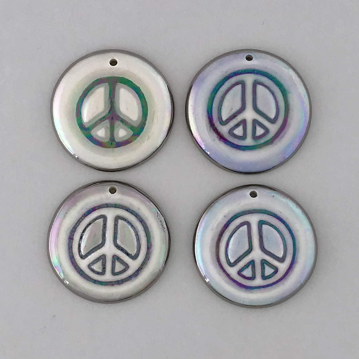 Peace signs never go out of style, matching earrings available.
