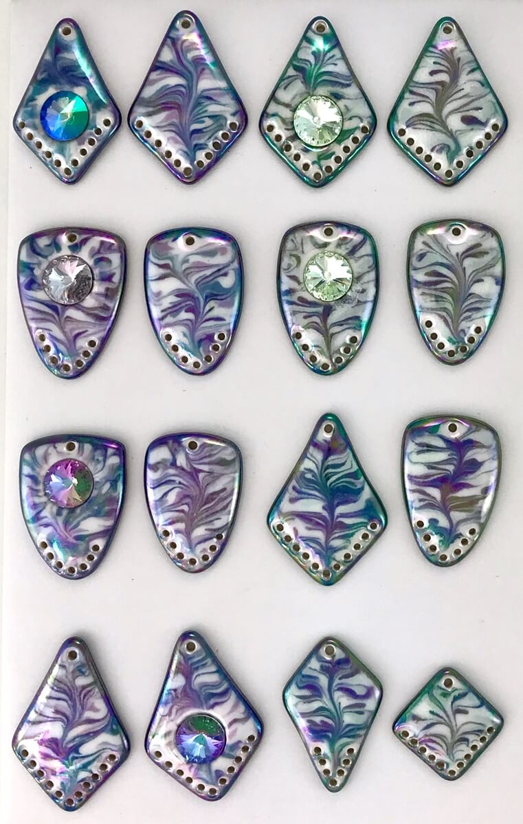 Marbled porcelain pendant components with additional holes for adding beadwork, etc.