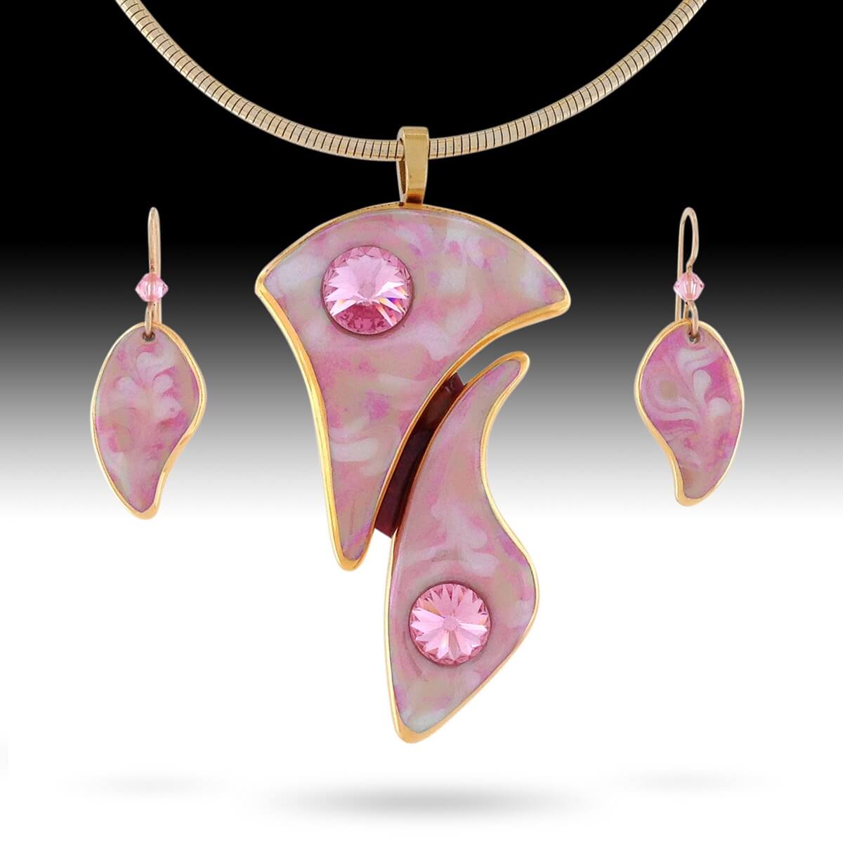 Multi-piece statement pendant with coordinating earrings in rosy pinks. 