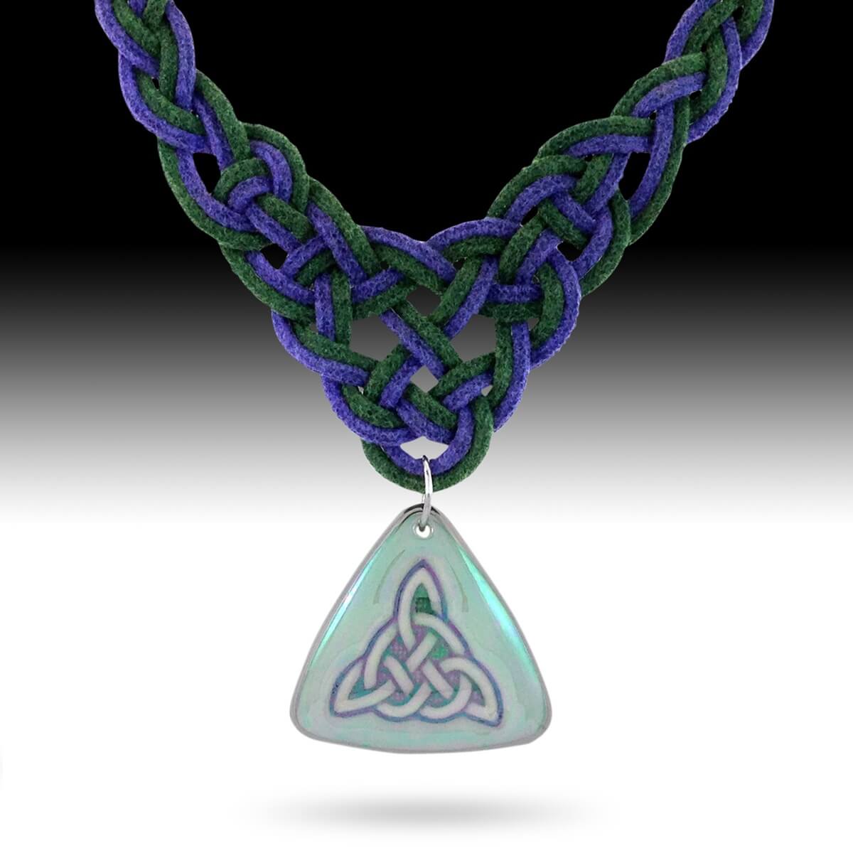Porcelain Celtic trinity pendant shown on a Celtic woven necklace
