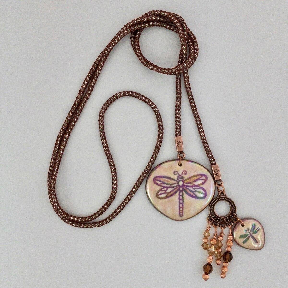Lariat necklace with porcelain dragonfly accents.