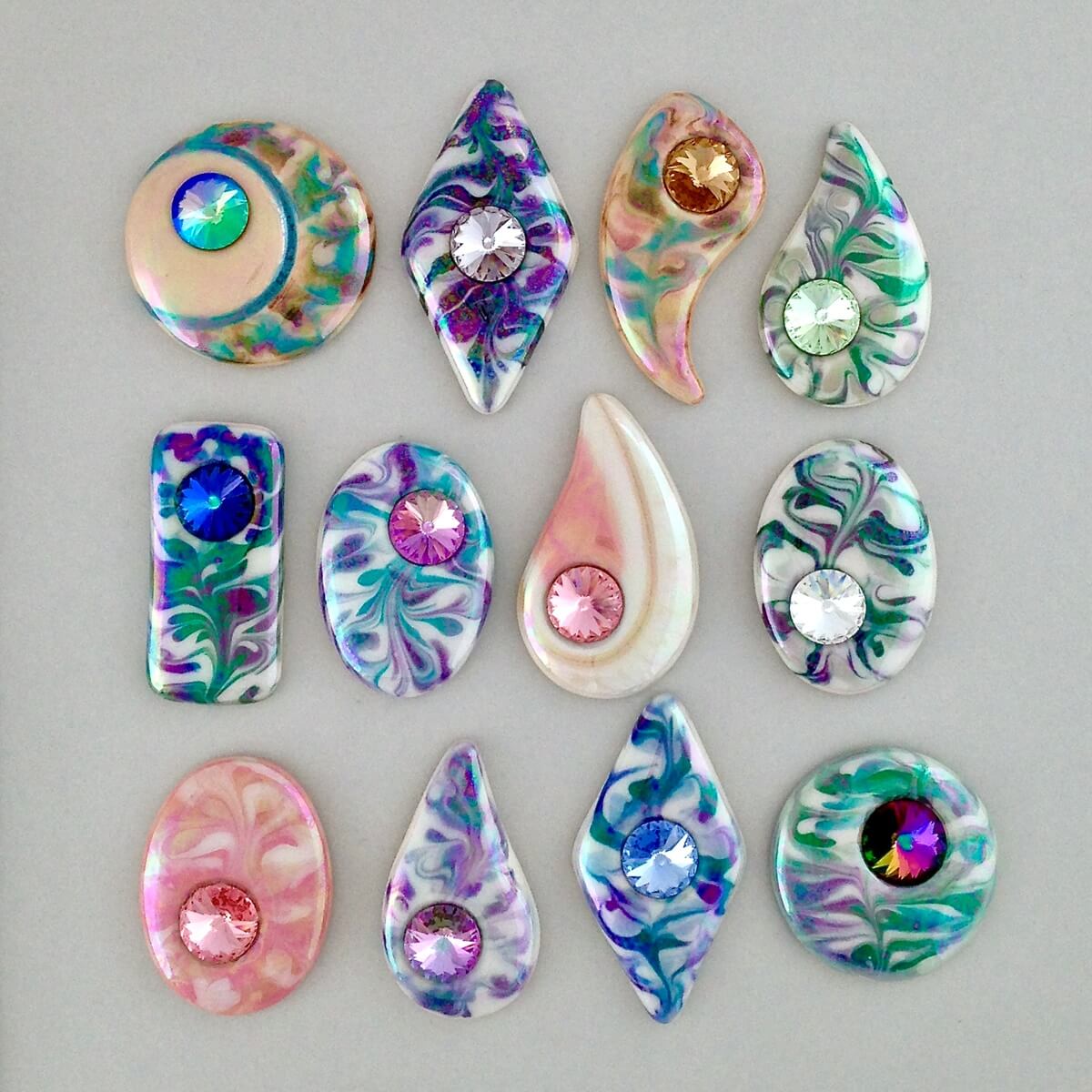 Porcelain cabochons with Swarovski crystal accents.