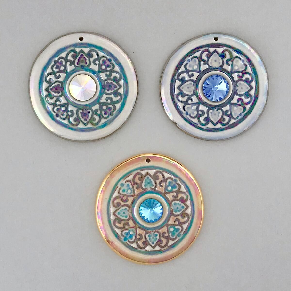Large mandala pendants with Swarovski Rivoli crystal accents.
