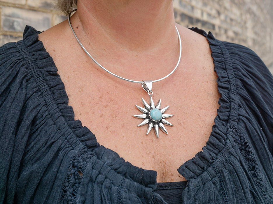 Our best-selling turquoise sunburst on a silver choker. 