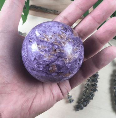 A beautiful charoite sphere.