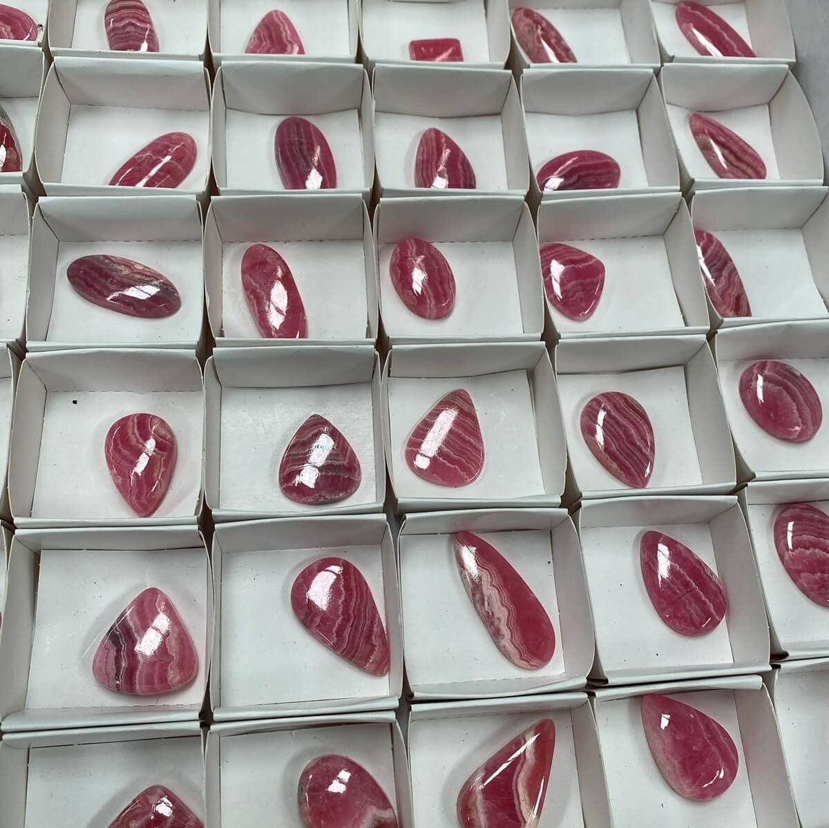 B2B Minerals wholesales cabochons like these Argentinian Rhodochrosite cabochons.