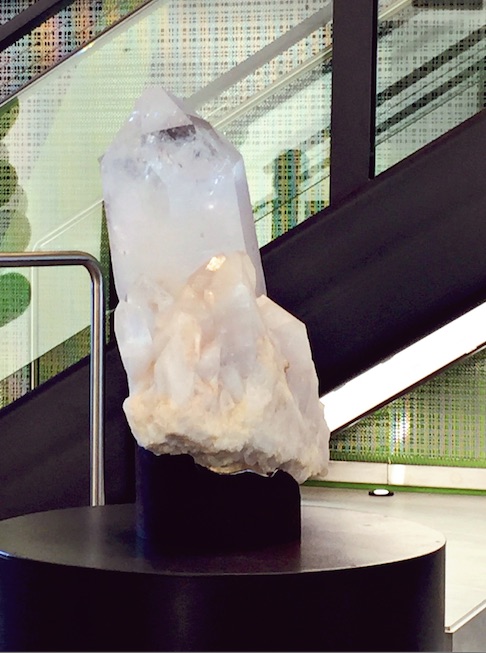 Giant natural clear quartz point in office lobby